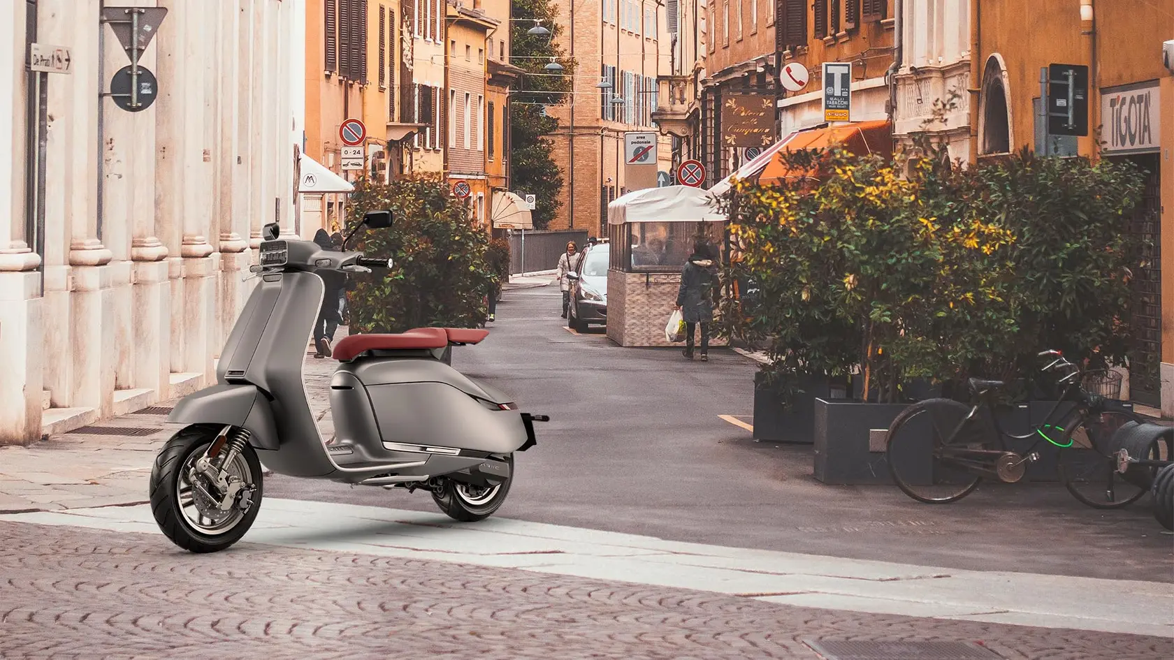 Brio II on a quiet side street lined with shops and plants