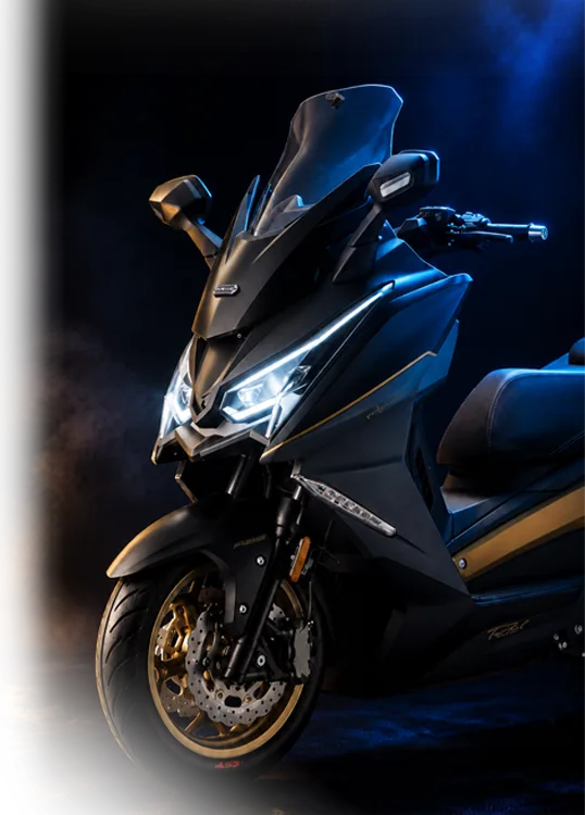 ARIIC 318GT-S in Midnight Gilt, headlights on, in a dark studio