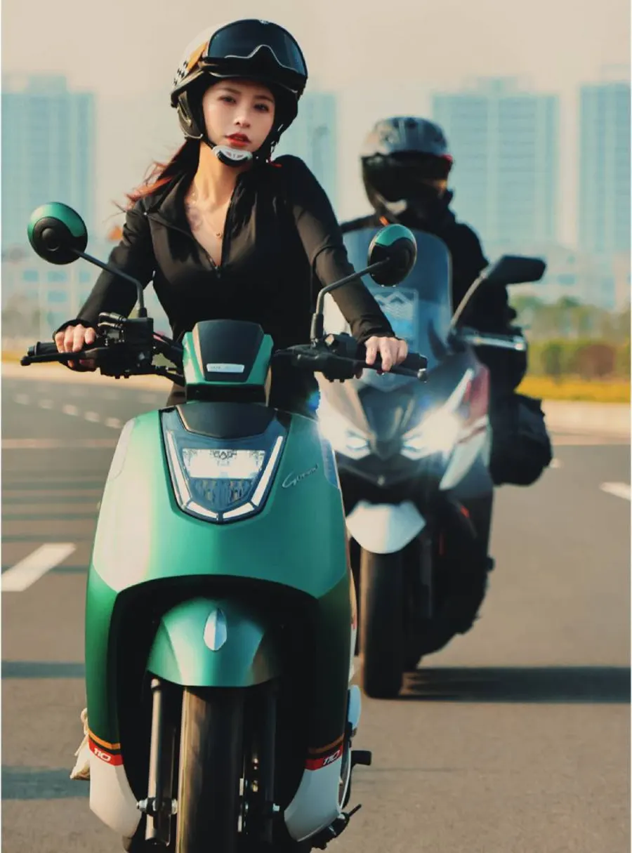 A rider on a green Gemma in the city